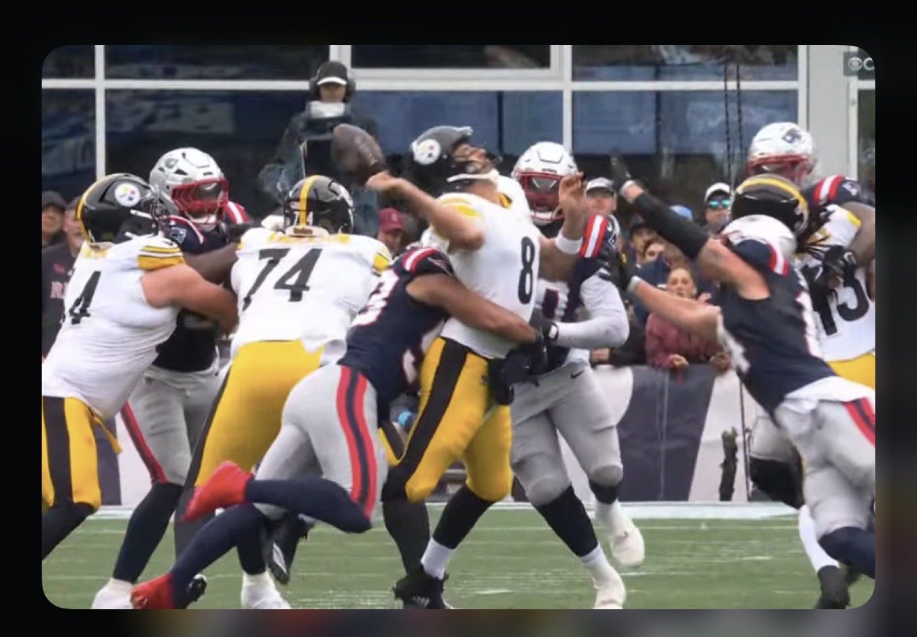 Aaron Rodgers folded in half by a Patriots blitz.