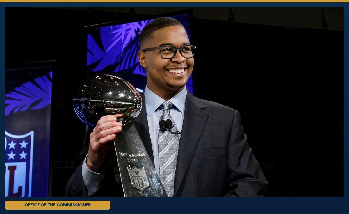 The commissioner, at the podium.